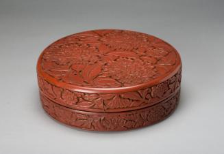 Lidded box with carved flower designs