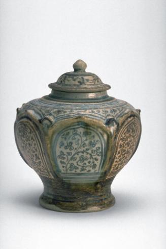 Lidded and paneled jar