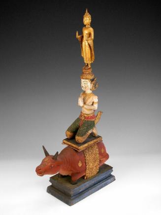 The Buddha standing on the head of the Shiva