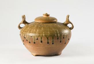 Covered jar with two animal-mask handles