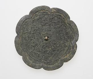 Eight-lobed mirror with design of floral scrolls and inscribed character Han