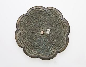 Eight-lobed mirror with design of floral scrolls